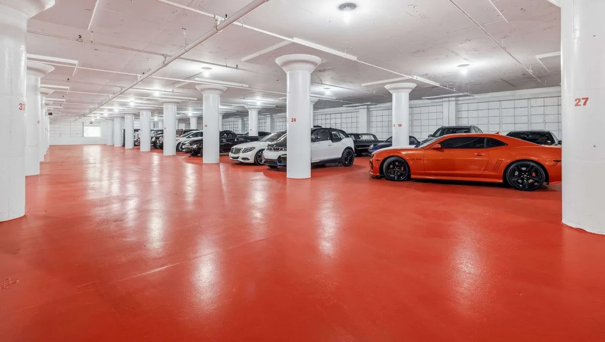 Wide view of the actual Premier Auto Storage indoor facility with modern automobiles